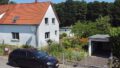 Ansicht Haus und Garage